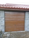 Brama garażowa uchylna, szeroki panel, złoty dąb